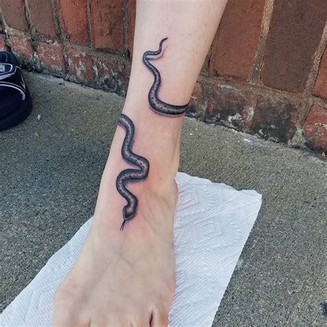 Top 10 snake tattoos wrap around leg ideas and inspiration